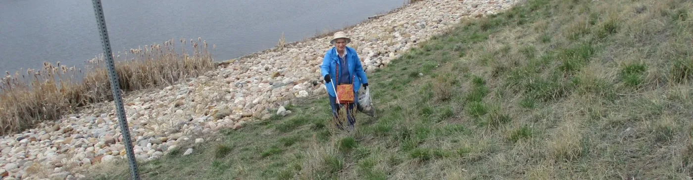 Volunteers working together along the riverbank